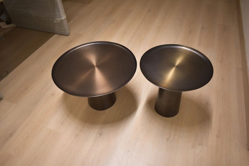 Pair of spun-bronze centre tables