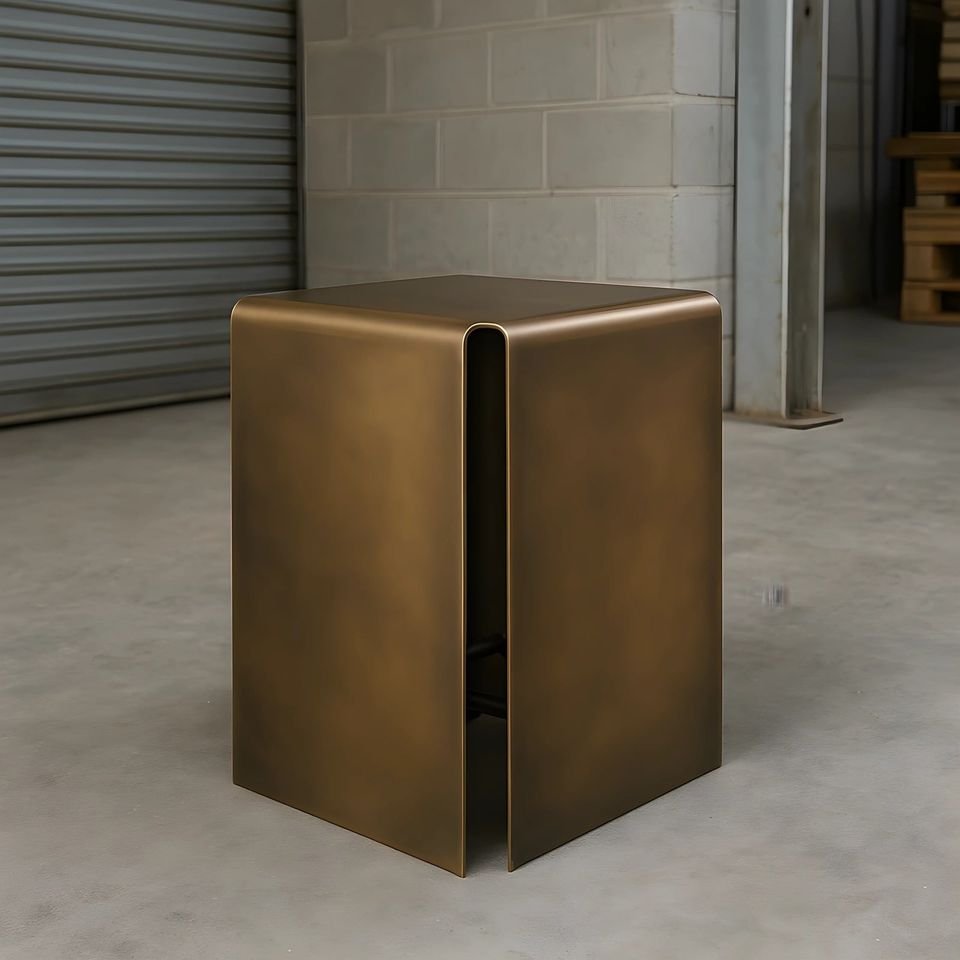 Folded bronze-finish side table