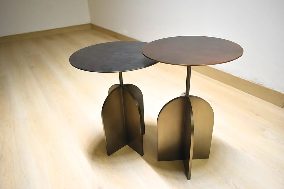 Pair of side tables with arched metal legs