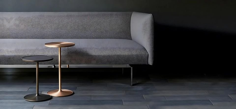 Tall slim side tables beside a sofa