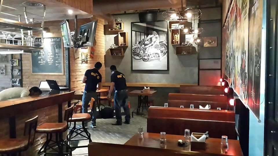 Café seating with booths and industrial lighting
