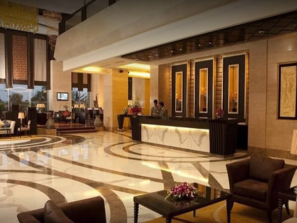 Hotel lobby with marble floor and reception counter