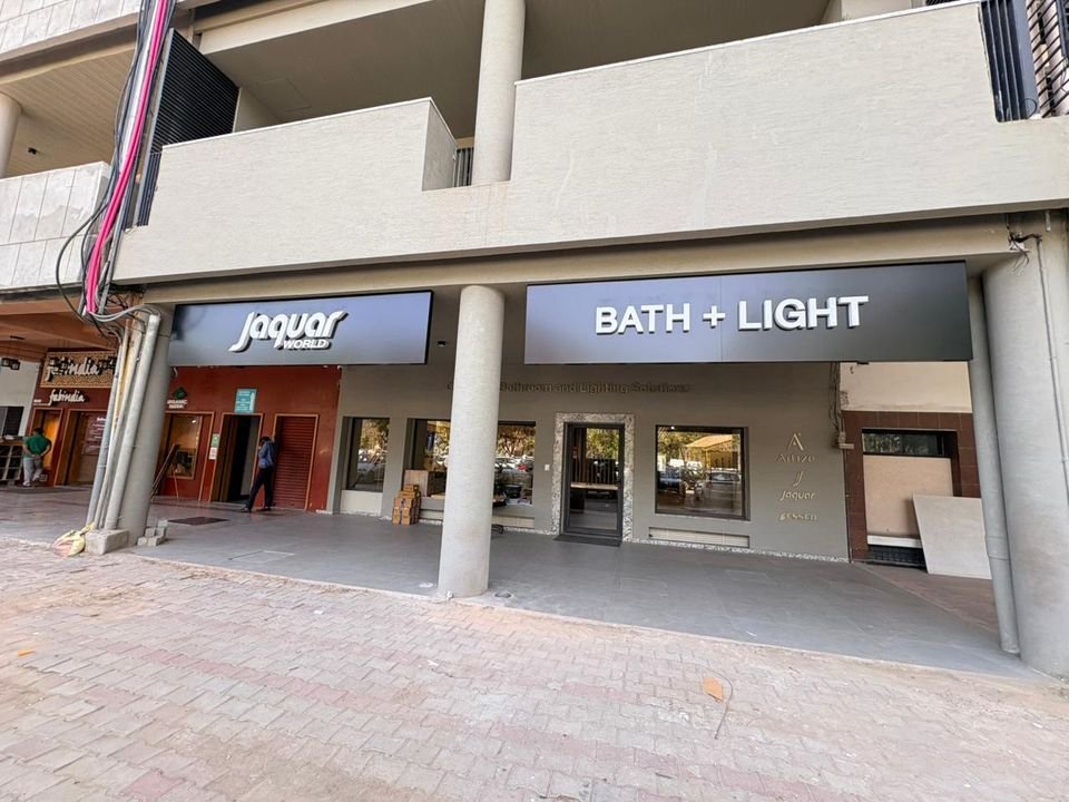 Bath + Light building front. The building frontage, with Jaquar World and BATH + LIGHT fascia signs above the glazed ground floor.