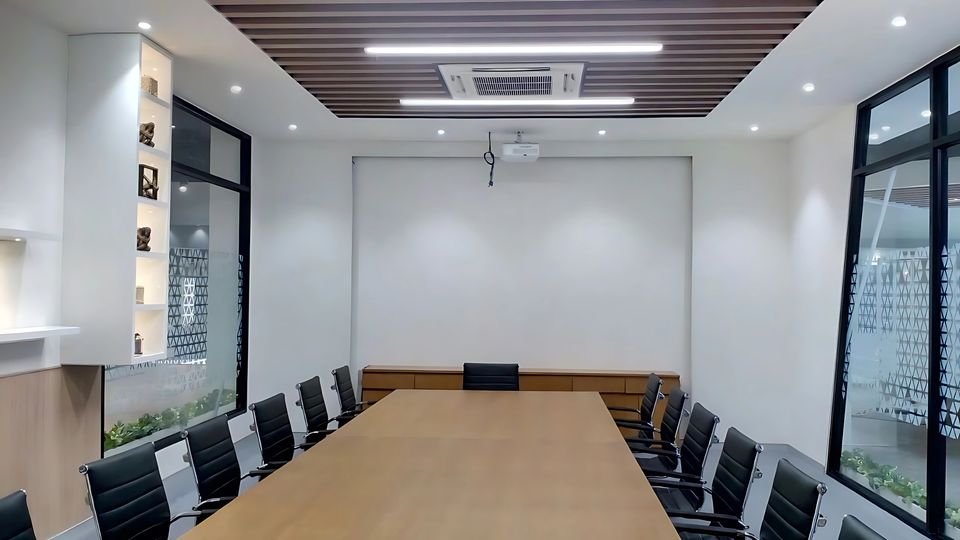 Meeting room with timber-slat ceiling and display shelving