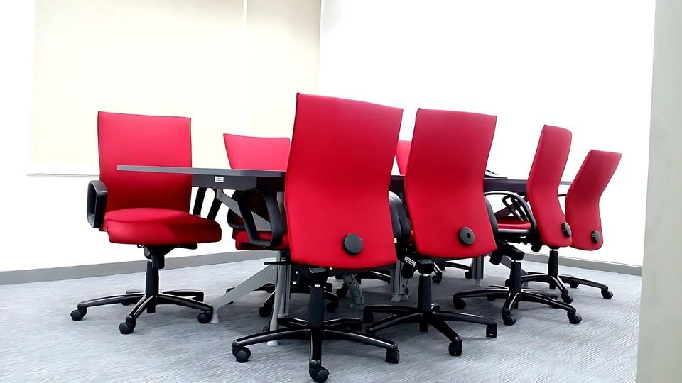 Meeting room with red task chairs
