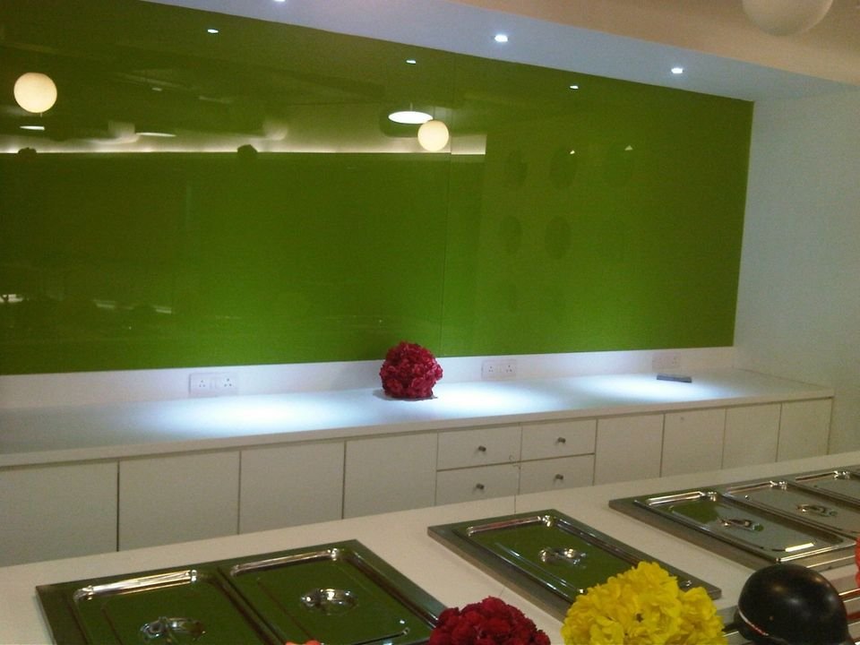Servery counter with green glass splashback