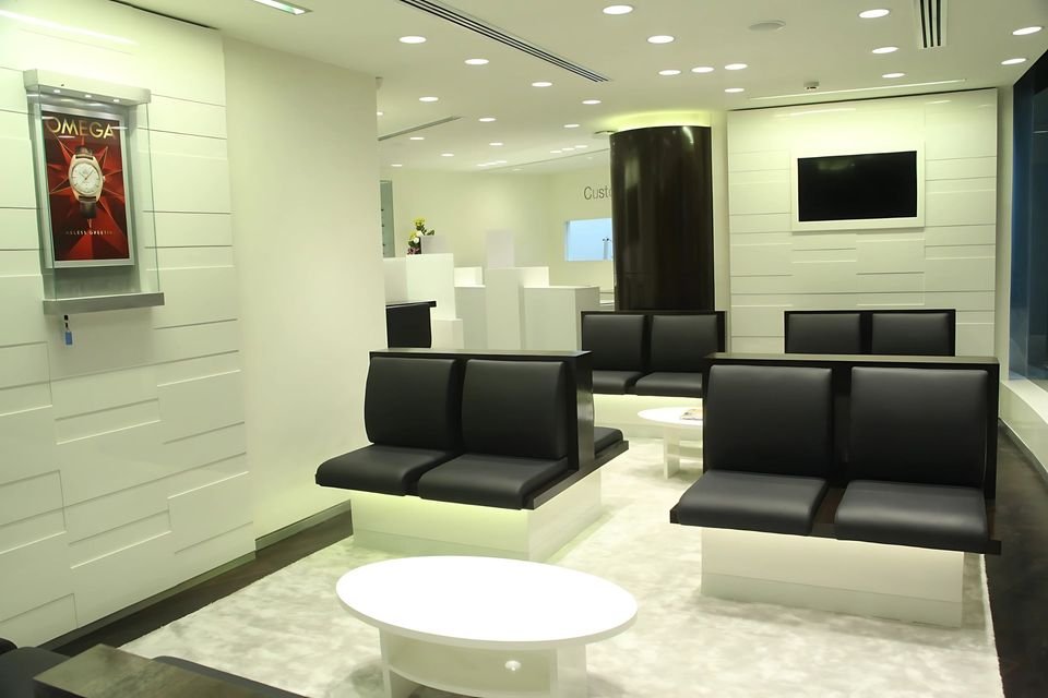 Waiting area with upholstered benches and panelled walls
